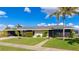 Mid-century modern home with updated exterior and landscaping at 181 Beeney Se Rd, Port Charlotte, FL 33952