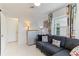 Bright living room with mid century modern furniture and large window at 181 Beeney Se Rd, Port Charlotte, FL 33952
