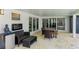 Outdoor patio with seating and a fireplace at 181 Beeney Se Rd, Port Charlotte, FL 33952