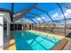 Inviting, screened-in pool with ample space for relaxation at 181 Beeney Se Rd, Port Charlotte, FL 33952