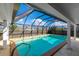 Inviting screened pool perfect for relaxation at 181 Beeney Se Rd, Port Charlotte, FL 33952