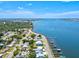 Aerial view of waterfront property with a home and surrounding neighborhood at 1914 Riverside E Dr, Bradenton, FL 34208