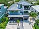 Stunning aerial view of a two-story home with modern design at 1914 Riverside E Dr, Bradenton, FL 34208