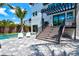 Modern home with a large backyard, pool, and deck at 1914 Riverside E Dr, Bradenton, FL 34208