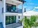 Private balcony overlooking the neighborhood with black metal railing at 1914 Riverside E Dr, Bradenton, FL 34208