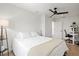 Bedroom with a queen-size bed, light walls, and hardwood floors at 1914 Riverside E Dr, Bradenton, FL 34208