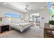 Main bedroom with water views and a king-size bed at 1914 Riverside E Dr, Bradenton, FL 34208
