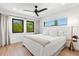 Bright bedroom with large windows, light walls, and hardwood floors at 1914 Riverside E Dr, Bradenton, FL 34208