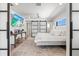 Bright bedroom featuring a king-size bed and stylish decor at 1914 Riverside E Dr, Bradenton, FL 34208