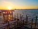 Serene waterfront dock with boat slip and sunset views at 1914 Riverside E Dr, Bradenton, FL 34208