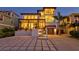 Evening view of a beautiful waterfront home with stylish exterior at 1914 Riverside E Dr, Bradenton, FL 34208