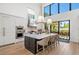 Modern kitchen features a large island and opens to a backyard patio at 1914 Riverside E Dr, Bradenton, FL 34208