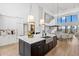 Gourmet kitchen with island, stainless steel appliances, and white cabinetry at 1914 Riverside E Dr, Bradenton, FL 34208