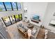Open living room with fireplace and water views at 1914 Riverside E Dr, Bradenton, FL 34208