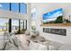 Bright living room with water views and fireplace at 1914 Riverside E Dr, Bradenton, FL 34208