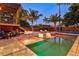 Expansive pool and spa with lounge chairs and pergola at 1914 Riverside E Dr, Bradenton, FL 34208