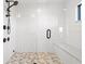 Large walk-in shower with tiled walls and built-in seat at 1914 Riverside E Dr, Bradenton, FL 34208