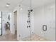 Spa-like shower with a rainfall showerhead and tiled walls at 1914 Riverside E Dr, Bradenton, FL 34208