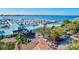 An aerial view of a waterfront marina with many boats and parking at 1914 Riverside E Dr, Bradenton, FL 34208
