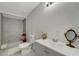 Clean bathroom with a walk-in shower and gray tile at 2726 Jerry Ave, Punta Gorda, FL 33950