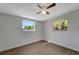 Well-lit bedroom with wood-look floors and two windows at 2726 Jerry Ave, Punta Gorda, FL 33950