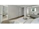 Light and airy bedroom with mirrored closet and wood-look floors at 2726 Jerry Ave, Punta Gorda, FL 33950