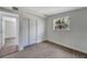 Spacious bedroom featuring wood-look floors and ample closet space at 2726 Jerry Ave, Punta Gorda, FL 33950