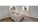 Bright bedroom with wood-look floors and window coverings at 2726 Jerry Ave, Punta Gorda, FL 33950