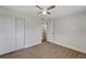 Light bedroom with wood-look floors and access to bathroom at 2726 Jerry Ave, Punta Gorda, FL 33950