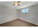 Simple bedroom with wood-look floors and a window at 2726 Jerry Ave, Punta Gorda, FL 33950