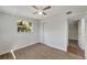 Bedroom featuring wood-look floors, ceiling fan, and window at 2726 Jerry Ave, Punta Gorda, FL 33950