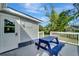 Blue picnic table on a deck overlooking the backyard at 2726 Jerry Ave, Punta Gorda, FL 33950