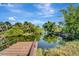 Wooden dock extending over a calm waterway at 2726 Jerry Ave, Punta Gorda, FL 33950