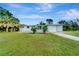 Newly renovated single story home with a carport and beautifully landscaped lawn at 2726 Jerry Ave, Punta Gorda, FL 33950