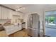 Modern kitchen with stainless steel appliances and white cabinets at 2726 Jerry Ave, Punta Gorda, FL 33950