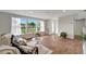 Bright and airy living room with tile floors and large windows at 2726 Jerry Ave, Punta Gorda, FL 33950