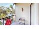 Private balcony with lake view and seating area at 305 30Th W Ave # A308, Bradenton, FL 34205