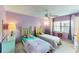 Guest bedroom with twin beds and a calming purple color scheme at 305 30Th W Ave # A308, Bradenton, FL 34205