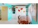 Charming dining area with built-in shelving and a lovely floral wall decal at 305 30Th W Ave # A308, Bradenton, FL 34205