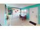 Light and airy entryway with a view to the dining area and access to exterior at 305 30Th W Ave # A308, Bradenton, FL 34205