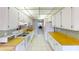 Efficient kitchen with white cabinets and wood countertops at 305 30Th W Ave # A308, Bradenton, FL 34205