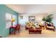 Relaxing living room with comfy seating and a teal accent wall at 305 30Th W Ave # A308, Bradenton, FL 34205
