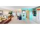 Living room boasts a teal accent wall, comfy seating, and a workspace at 305 30Th W Ave # A308, Bradenton, FL 34205