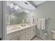 Bathroom boasts dual sinks, a large shower, and modern fixtures at 315 Hammock Cir, Anna Maria, FL 34216