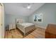 Bedroom with a full-size bed, nightstand and light wood floors at 315 Hammock Cir, Anna Maria, FL 34216