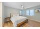 Spacious bedroom with a king-size bed and light wood floors at 315 Hammock Cir, Anna Maria, FL 34216