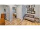Hallway with light wood floors and access to bedrooms at 315 Hammock Cir, Anna Maria, FL 34216