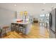 Modern kitchen features white cabinets, quartz countertops, and stainless steel appliances at 315 Hammock Cir, Anna Maria, FL 34216