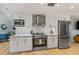 Stylish kitchen with stainless steel appliances and white cabinetry at 315 Hammock Cir, Anna Maria, FL 34216