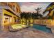Stunning pool and spa, surrounded by lush landscaping at 315 Hammock Cir, Anna Maria, FL 34216